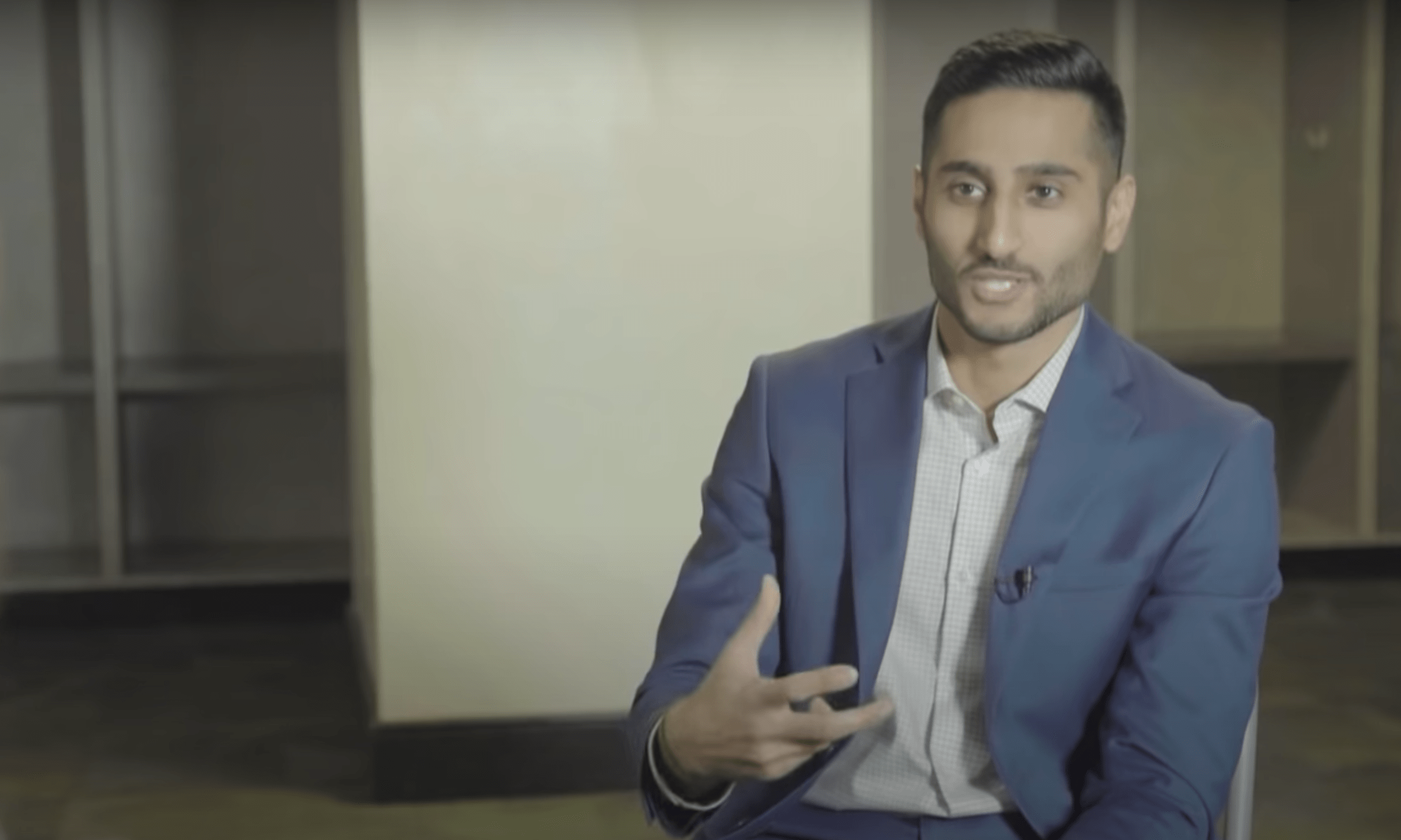 Shams Charania gestures during an interview.