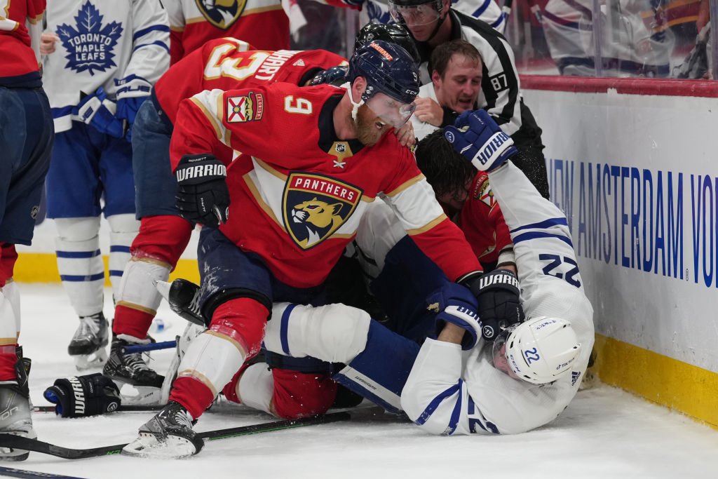 Sam Bennett and Jake McCabe hit each other