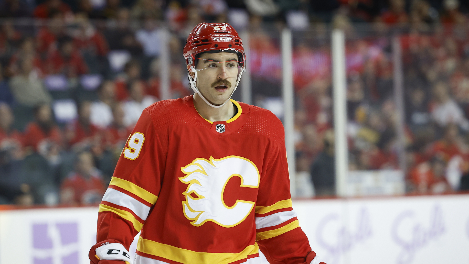 Dillon Dube #29 of the Calgary Flames during a break in play against the Vegas Golden Knights.