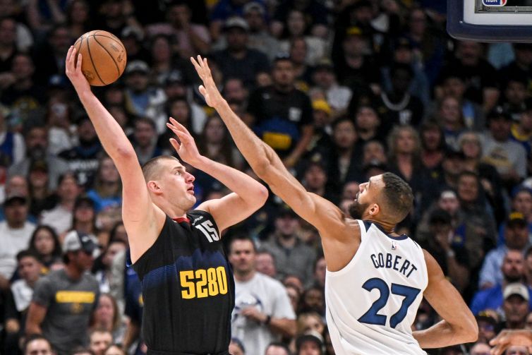 Nikola Jokic (15) of the Denver Nuggets shoots over Rudy Gobert (27) of the Minnesota Timberwolves during the second quarter at Ball Arena in Denver on Tuesday, May 14, 2024.