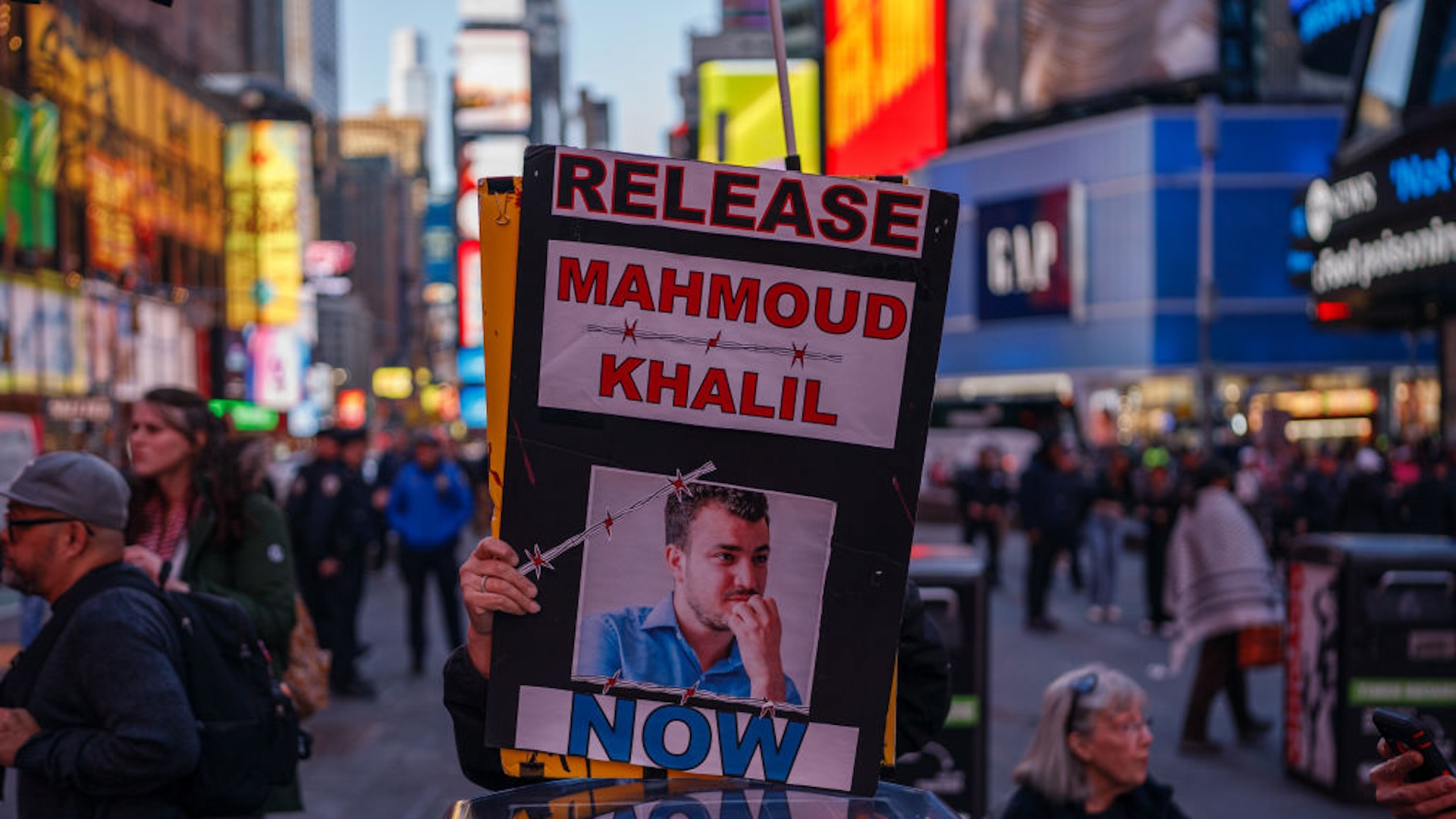 A person holds a sign calling for the release of Mahmoud Khalil as pro-Palestine demonstrators rally for Gaza in Times Square on March 18, 2025 in New York City. Israeli forces carried out renewed airstrikes across the Gaza Strip, killing over 400 people, according to Gaza officials. The attacks broke a temporary ceasefire with Hamas, heightening fears of a return to full-scale conflict.