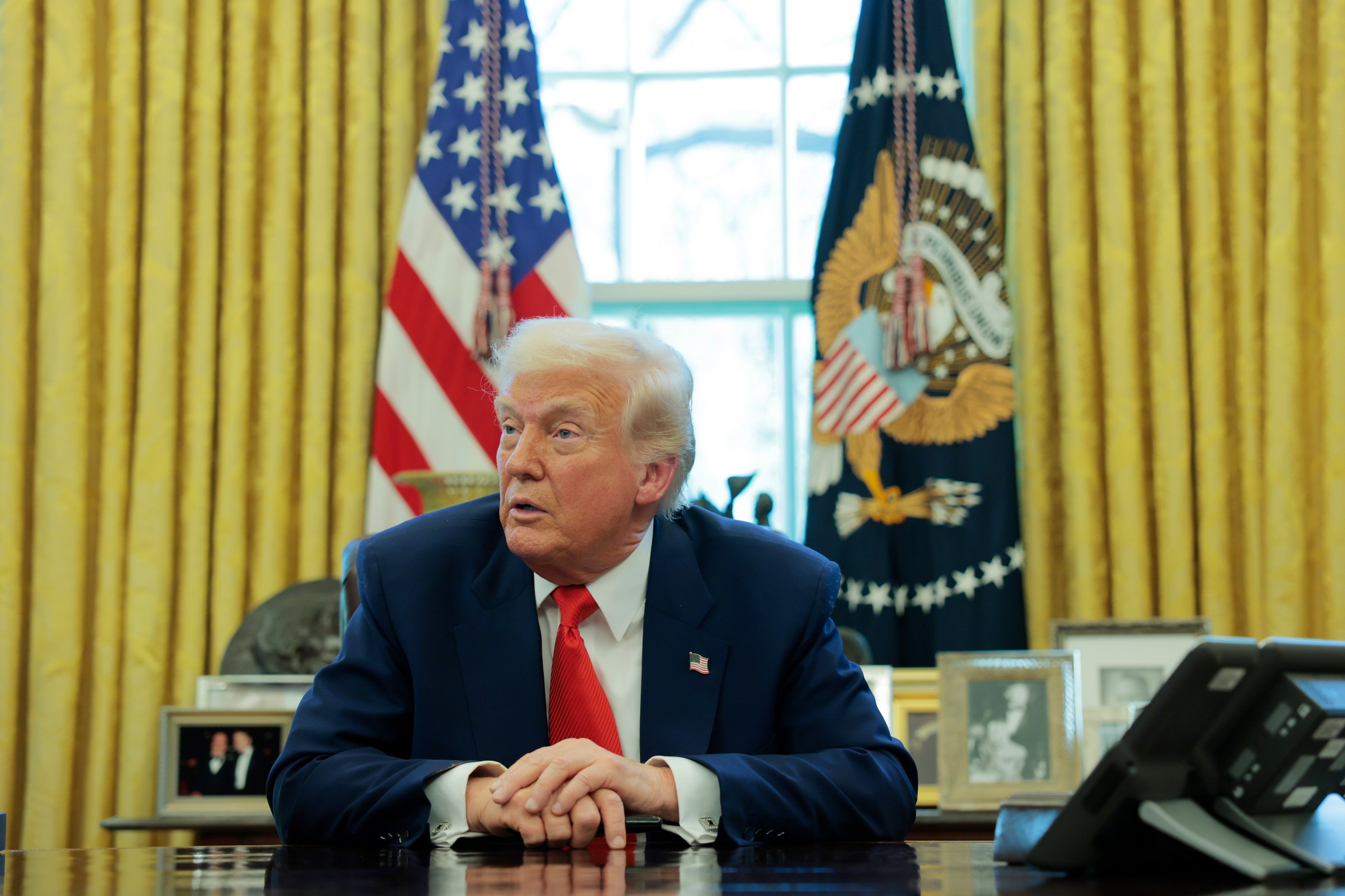 Donald Trump at his desk.