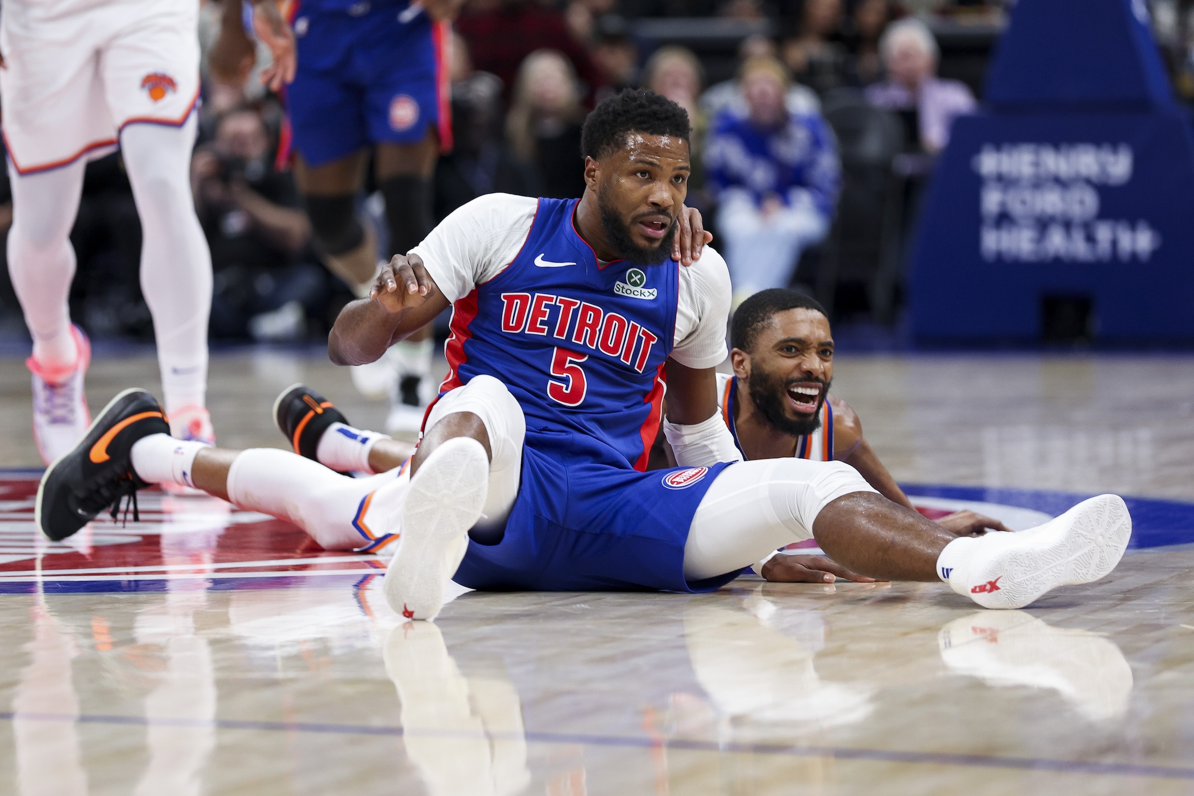 DETROIT, MICHIGAN - APRIL 10: Malik Beasley #5 of the Detroit Pistons and Mikal Bridges #25 of the New York Knicks look on during the third quarter of a game at Little Caesars Arena on April 10, 2025 in Detroit, Michigan. NOTE TO USER: User expressly acknowledges and agrees that, by downloading and or using this photograph, User is consenting to the terms and conditions of the Getty Images License Agreement. (Photo by Mike Mulholland/Getty Images)