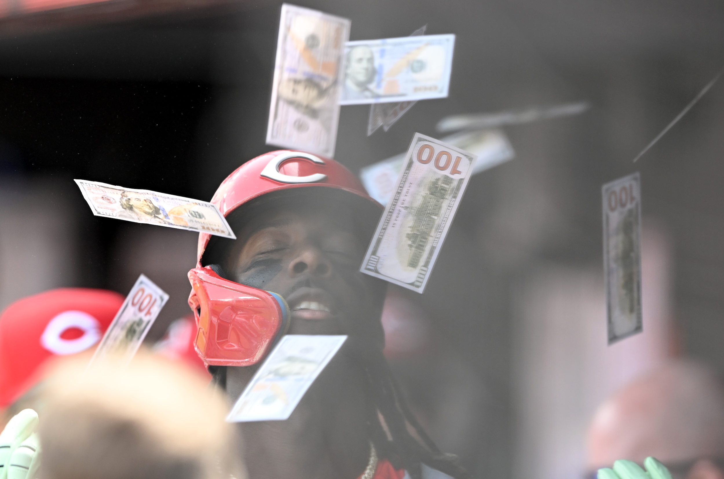 Elly De La Cruz is showered in $100 bills after socking a dinger.