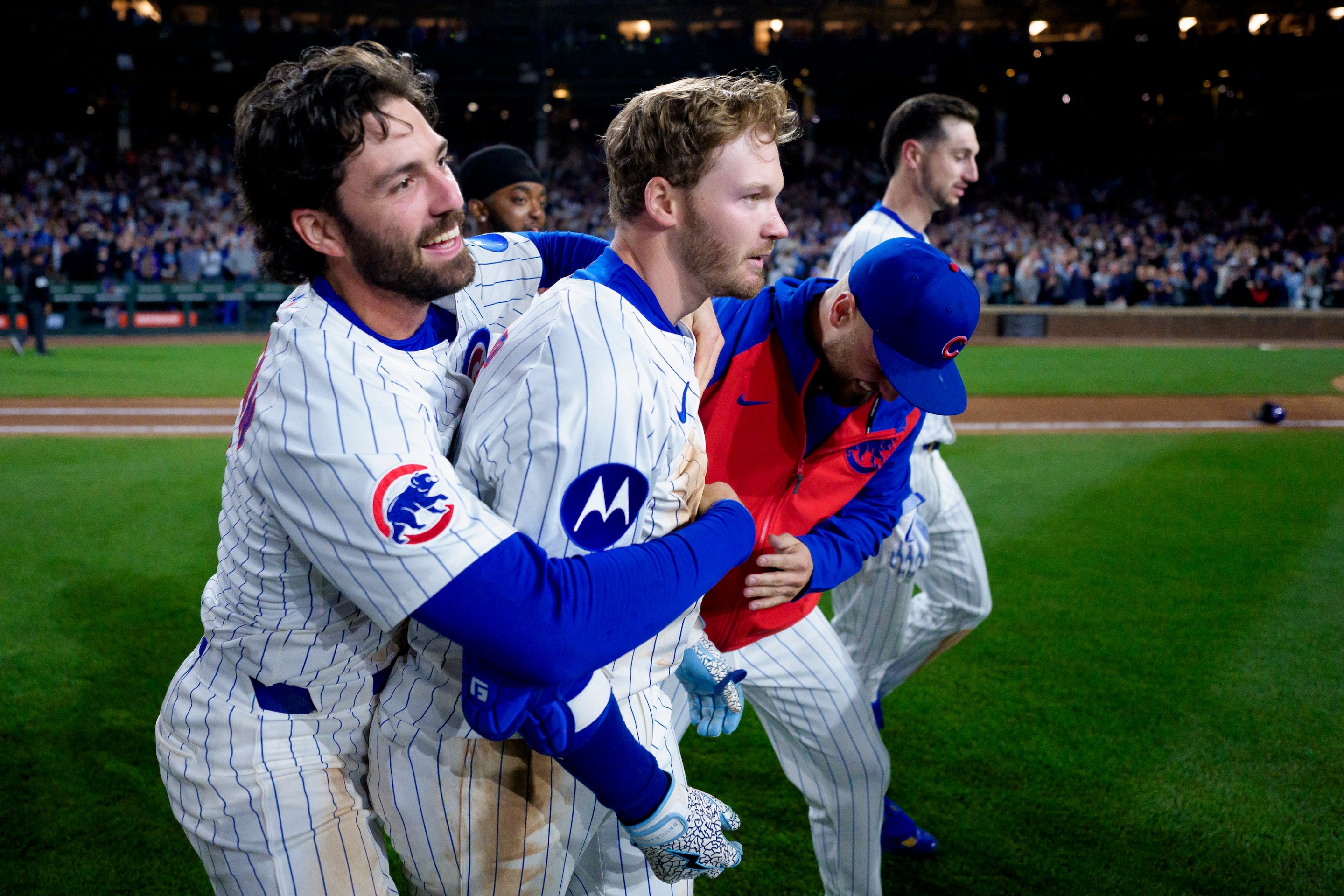 Ian Happ #8 of the Chicago Cubs celebrates a walk-off hit in the bottom of the tenth inning of a game against the Los Angeles Dodgers at Wrigley Field on April 22, 2025 in Chicago, Illinois.
