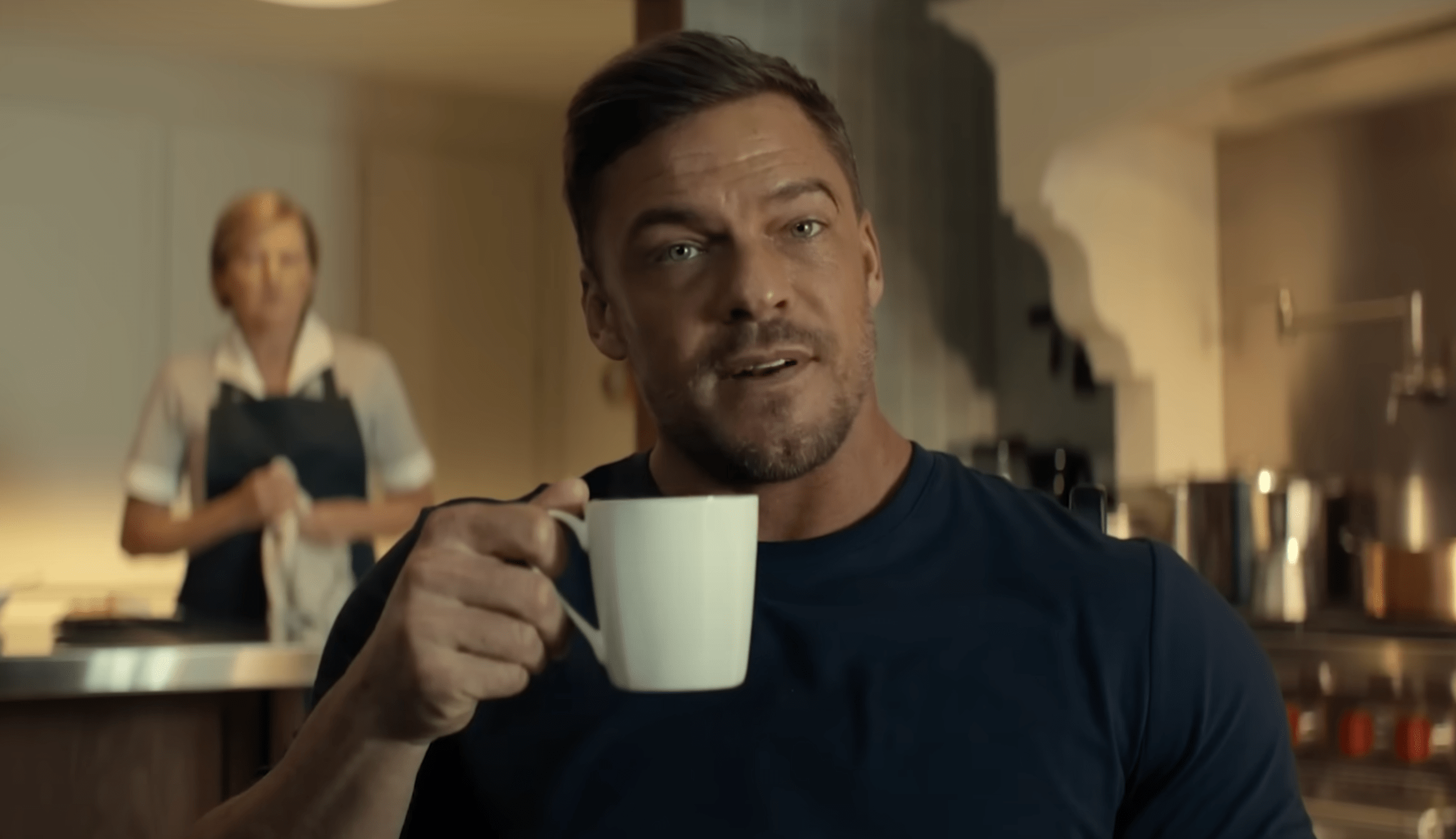 Reacher drinking coffee