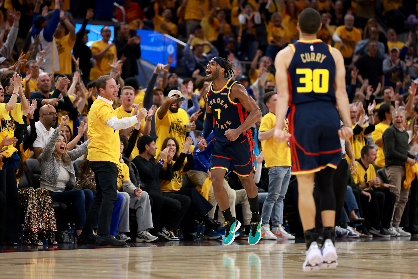 Buddy Hield #7 of the Golden State Warriors celebrates after making a three point basket against the Houston Rockets during the third quarter in Game Four of the Western Conference First Round NBA Playoffs.